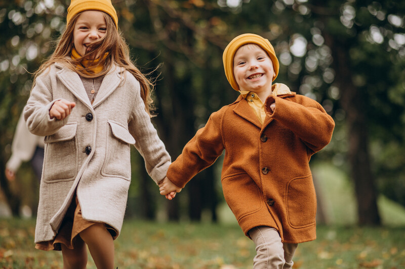 brother-sister-having-fun-together-park